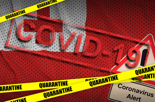 Tonga flag and Covid-19 quarantine yellow tape with red stamp. Coronavirus or 2019-nCov virus photo