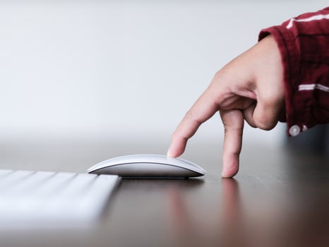 Hand reaching for the computer mouse photo