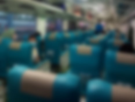 Defocused abstract background of Business train interior in shades of blue photo