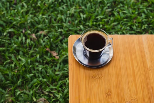 Top view cup of coffee on wooden table. photo