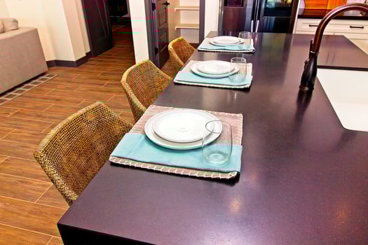Place Settings And Counter Stools At Kitchen Island photo