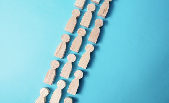 Chain people figures . Queue line. The movement of people in one direction. Human resources. Discipline. Social organization, joining consolidated forces. Team building. Common cause. Cooperation. photo