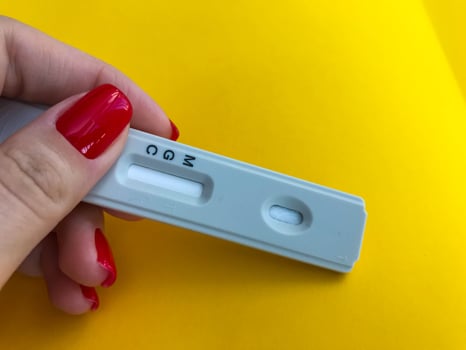 medical procedures. coronavirus test on a bright yellow background. new home self-diagnosis kit. antibody window, the nurse will drip blood from the finger to test for antibodies photo