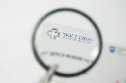 Pasific Cross Card under magnifying glass with Selective Focus photo