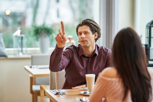 Young Couple Enjoying Coffee And Cake In Cafe photo