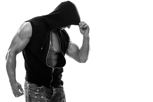 Handsome muscular man posing in studio on white background photo