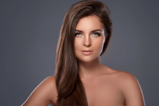 Beautiful and young woman with a artificial eyelashes photo