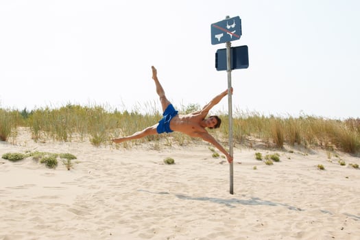 Muscular man during his workout on the beach photo