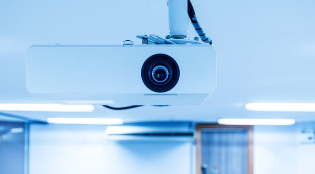 Close up Multimedia projector installed on the ceiling photo