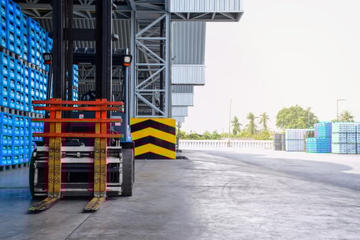 Forklift trucks parked in a warehouse. photo