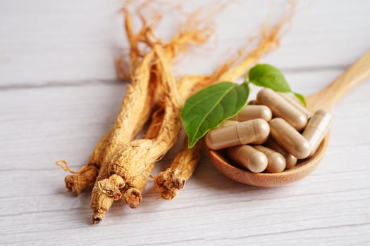 Ginseng roots and green leaf, healthy food. photo