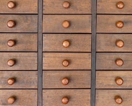 Wooden cabinet with several drawers photo
