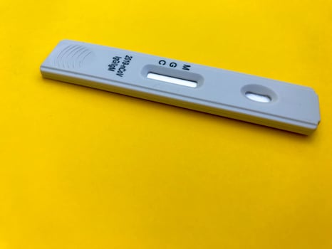 medical procedures. coronavirus test on a bright yellow background. home kit for self-diagnosis. medical procedures for the determination of IgG and IgM antibodies photo