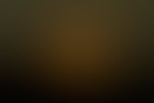 Yellow dark gold abstract blur effect background photo