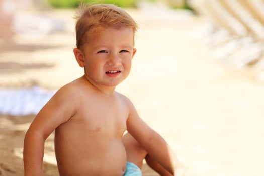 Little boy on vacations at beach photo