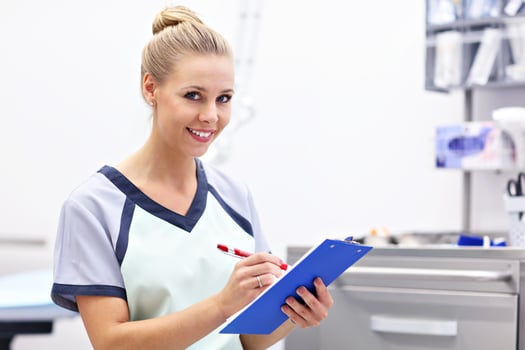 Portrait Of Female Nurse Standing In Hospital Lab photo