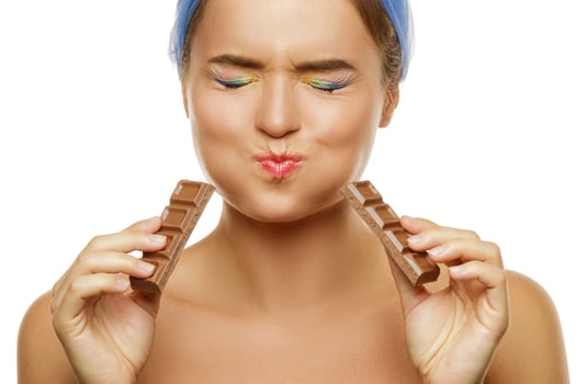 Woman in doubt about eating a chocolate photo