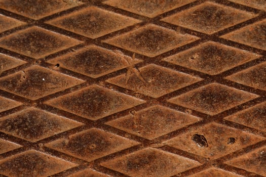 Rusty metal texture. Steel surface with rhombus pattern photo