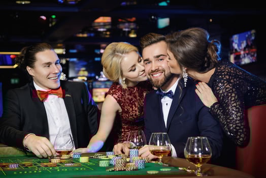 Guy was kissed by two beautiful girls after win in roulette photo