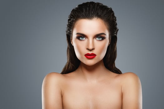 Portrait of beautiful young woman with a red lipstick photo