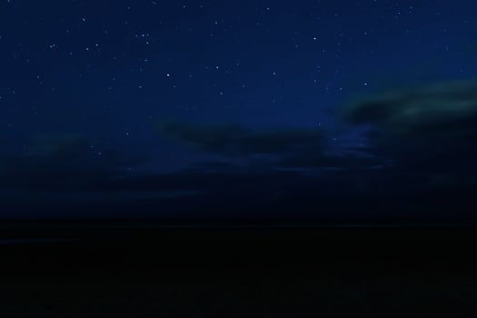 Night sky with stars and clouds in motion photo