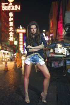 Sexy and beautiful model is posing in the Chinatown photo