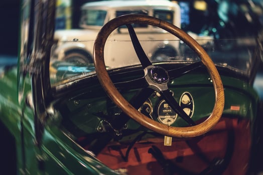 Steering wheel and part of interior of the retro photo