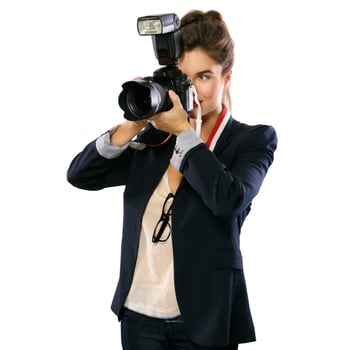 Woman photographer with a DSLR camera on white background photo