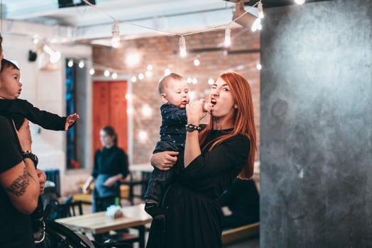 Mom is holding his little son in her arms photo