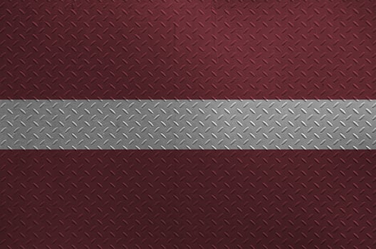 Latvia flag depicted in paint colors on old brushed metal plate or wall closeup. Textured banner on rough background photo