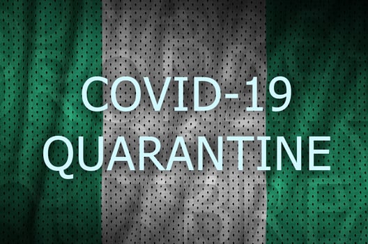Nigeria flag and Covid-19 quarantine inscription. Coronavirus or 2019-nCov virus photo