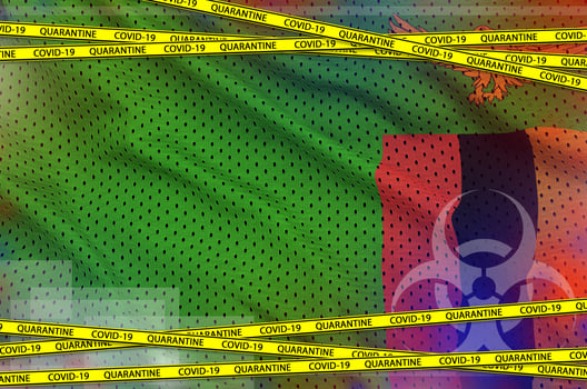 Zambia flag and Covid-19 quarantine yellow tape. Coronavirus or 2019-nCov virus concept photo