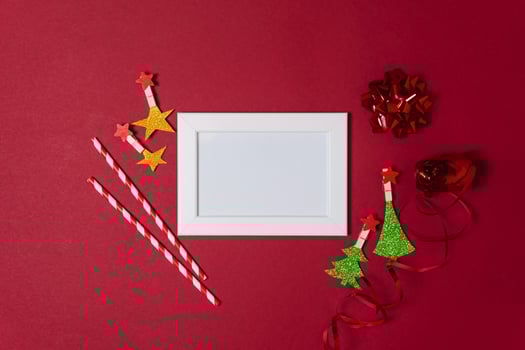 New Year and Christmas decorations on red background, flat lay. photo