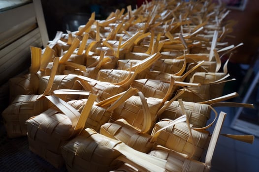 Ketupat is indonesia traditional food. Ketupat is Rice cake boiled in a rhombus-shaped packet of plaited young coconut leaves. photo