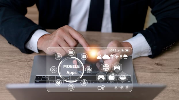 mobile apps concept.Business man hands holding touch screen smartphone outside in the park,color filter,all element graphic are made up by me photo