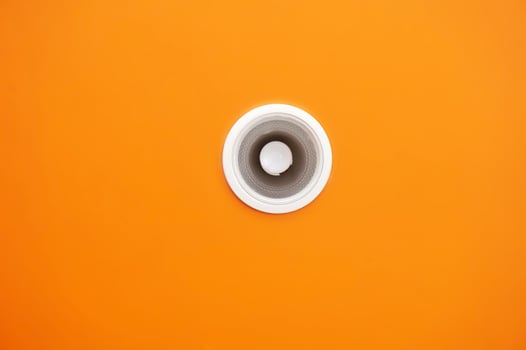 White lamp on the top of roof orange background. photo