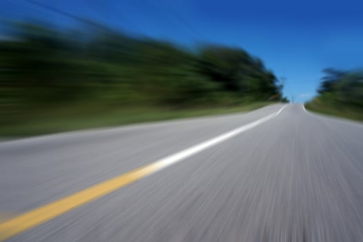 Highway road speed lines yellow and white texture background, radial motion blur, zooming effect. photo