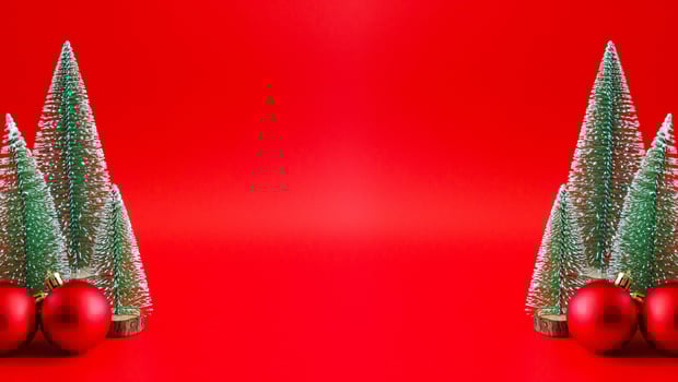 Christmas tree and baubles on red background new year  holiday celebration concept photo