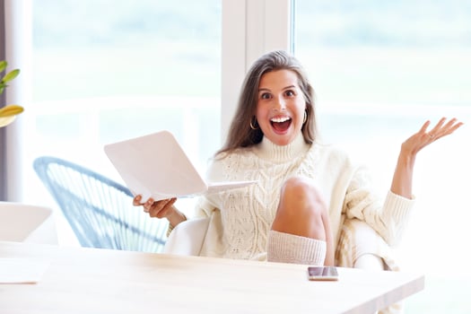 Adult woman wearing warm sweater and working at home one autumn day photo