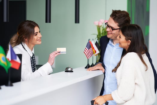 Adult couple checking-in a hotel photo