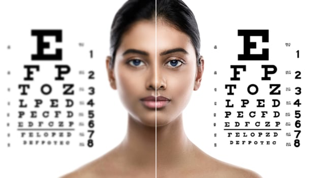 Indian woman and eye chart for sight test photo
