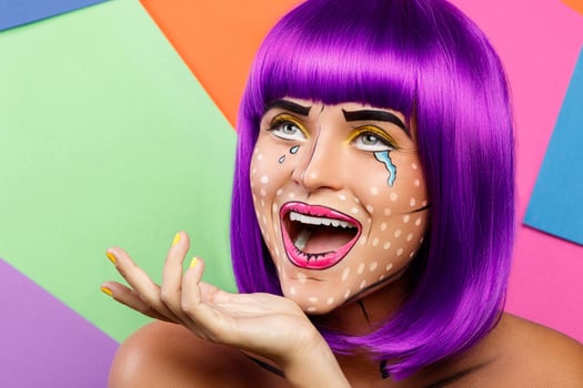Model in creative image with pop art makeup photo