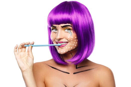 Model in creative image with pop art makeup photo