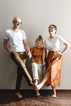 Young and happy family having fun at home photo