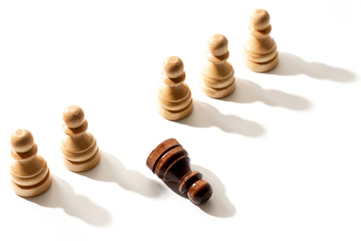 One black chess pawn among whites. Concept of racism and discrimination. photo