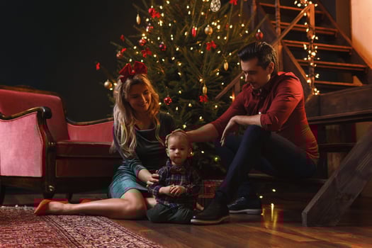 Young happy family are celebrating Christmas or New year. photo