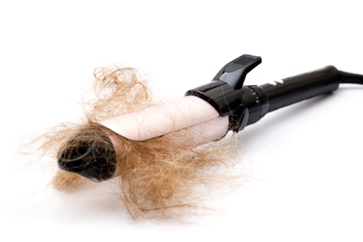 Hair curler tool and clump of hair photo