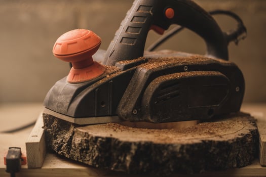 Portable electric wood planer in the workshop photo