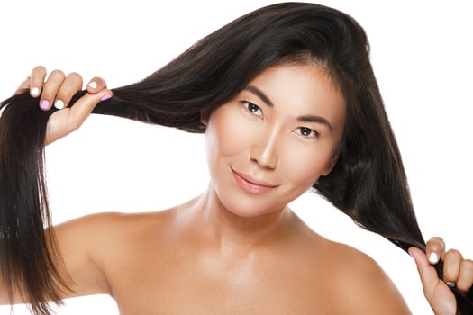 Asian woman with a healthy black hair photo