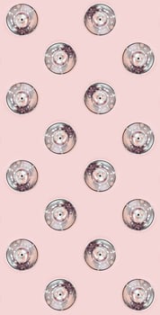 Many used spray cans for graffiti drawing lies on a pastel colored backgroung. Street art painting concept. Minimal flat lay pattern. Top view photo